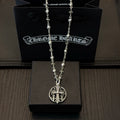 Silver-toned necklace with oval cross pendant and charm-link chain