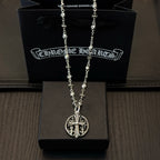 Silver-toned necklace with oval cross pendant and charm-link chain