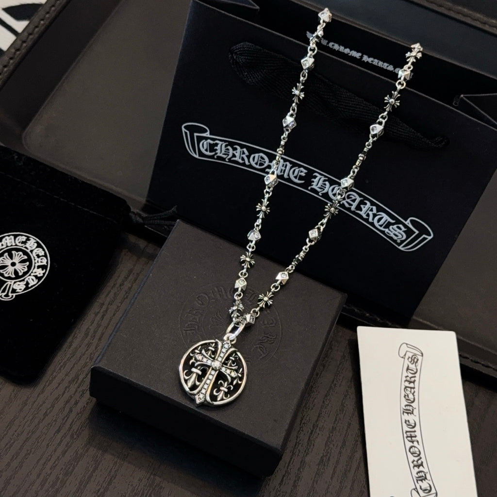 Silver-toned long necklace with oval crest pendant on charm-link chain