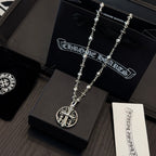 Silver-toned long necklace with oval crest pendant on charm-link chain