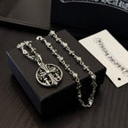 Silver-toned necklaces set with oval cross pendant and flower detail links