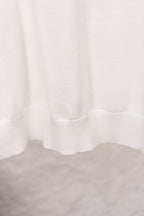 White sweater ribbed hem with soft drape
