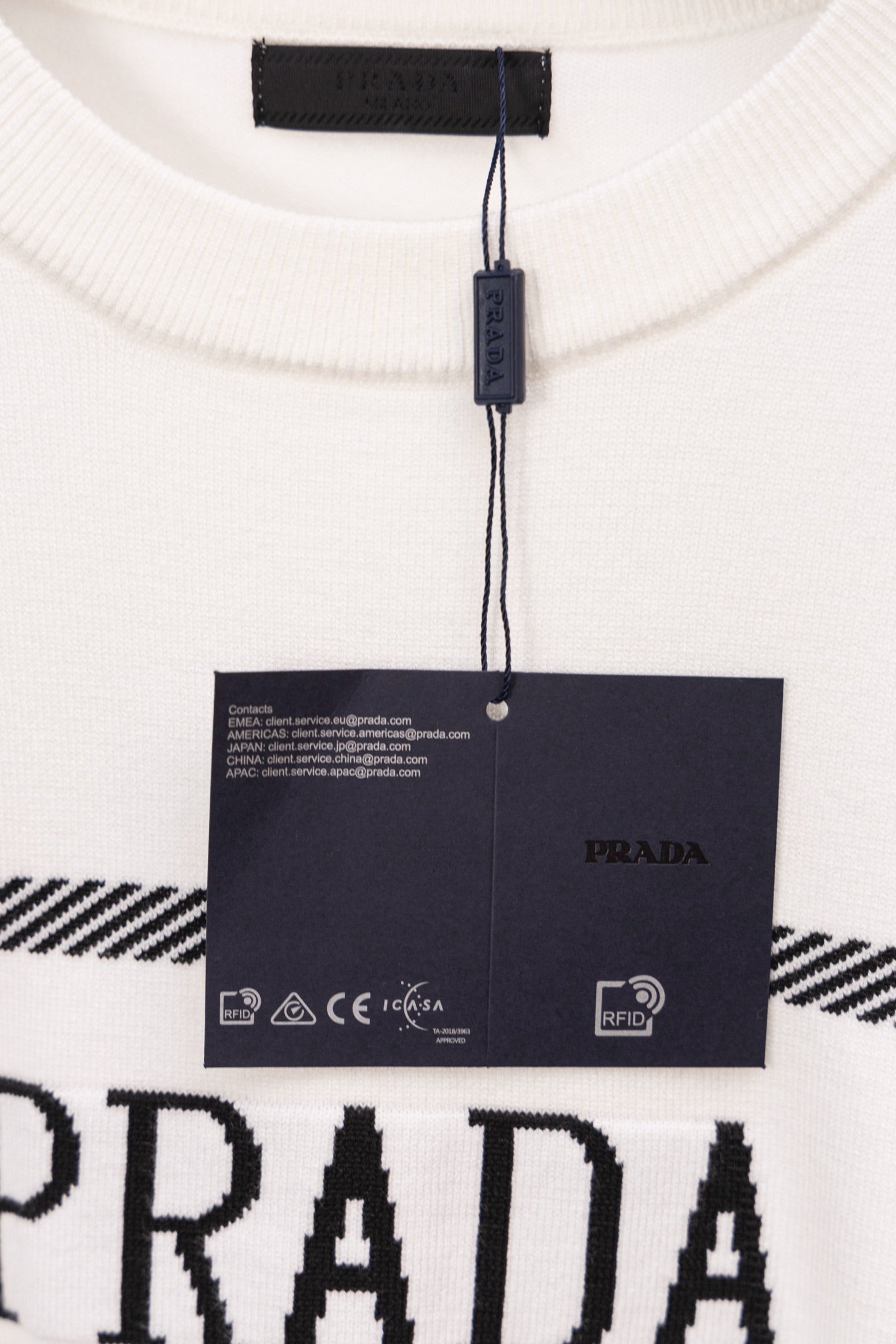PRADA white sweater neckline with black label and hanging tag