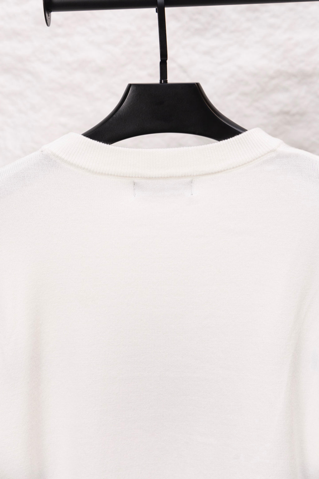 White long-sleeve crewneck sweater, solid back view