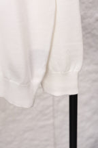 White sweater hem and ribbed cuff detail