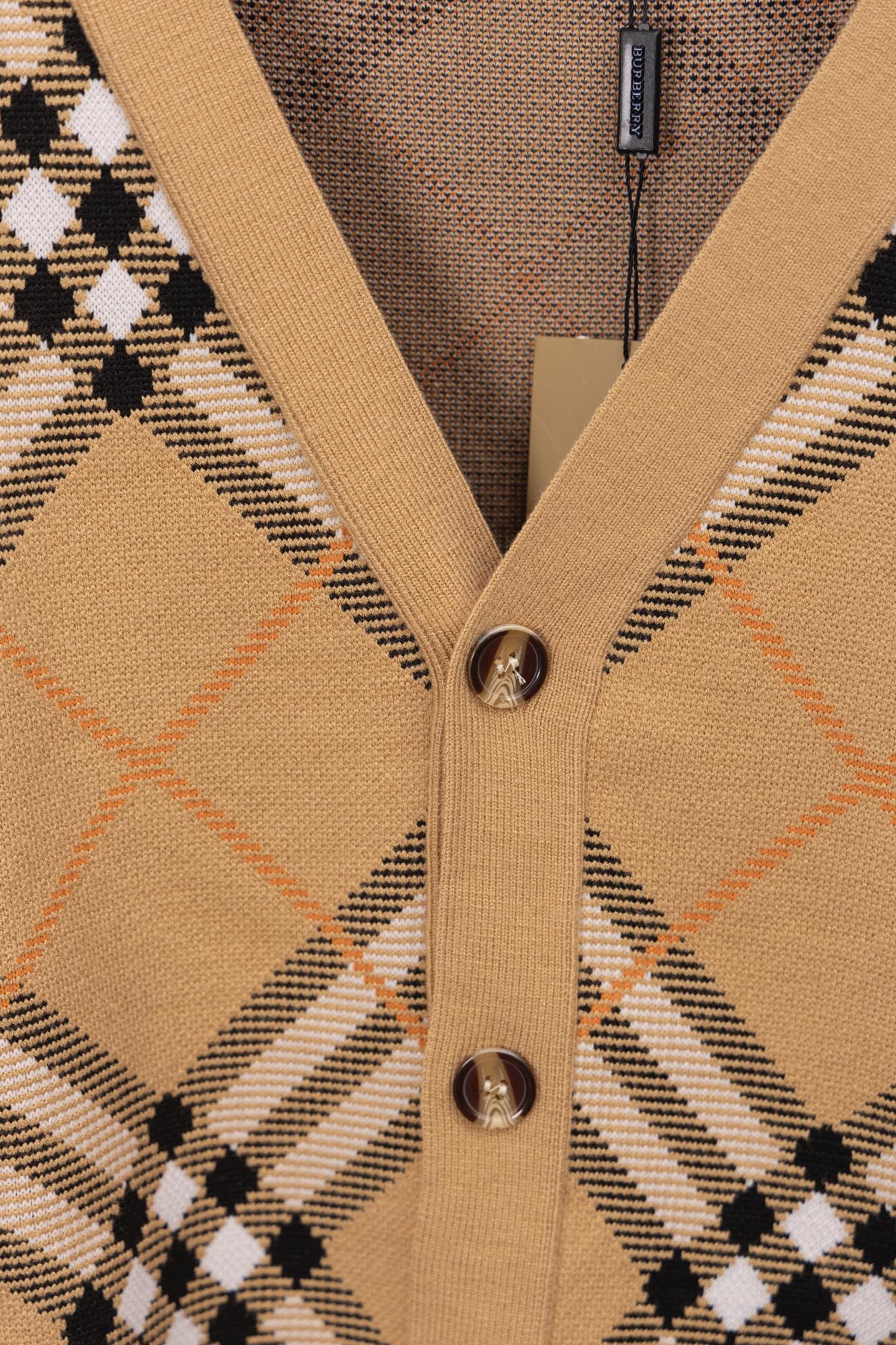 Burberry tan plaid cardigan center placket with metal buttons