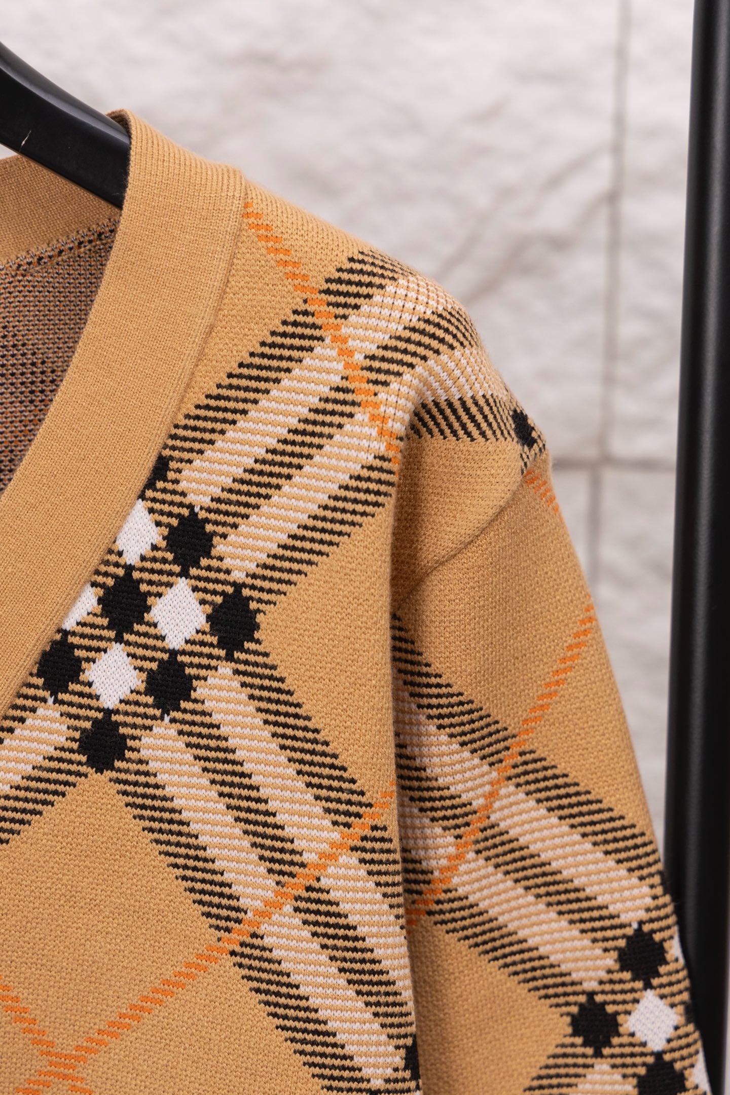 Burberry plaid cardigan sleeve in tan with black and white check pattern