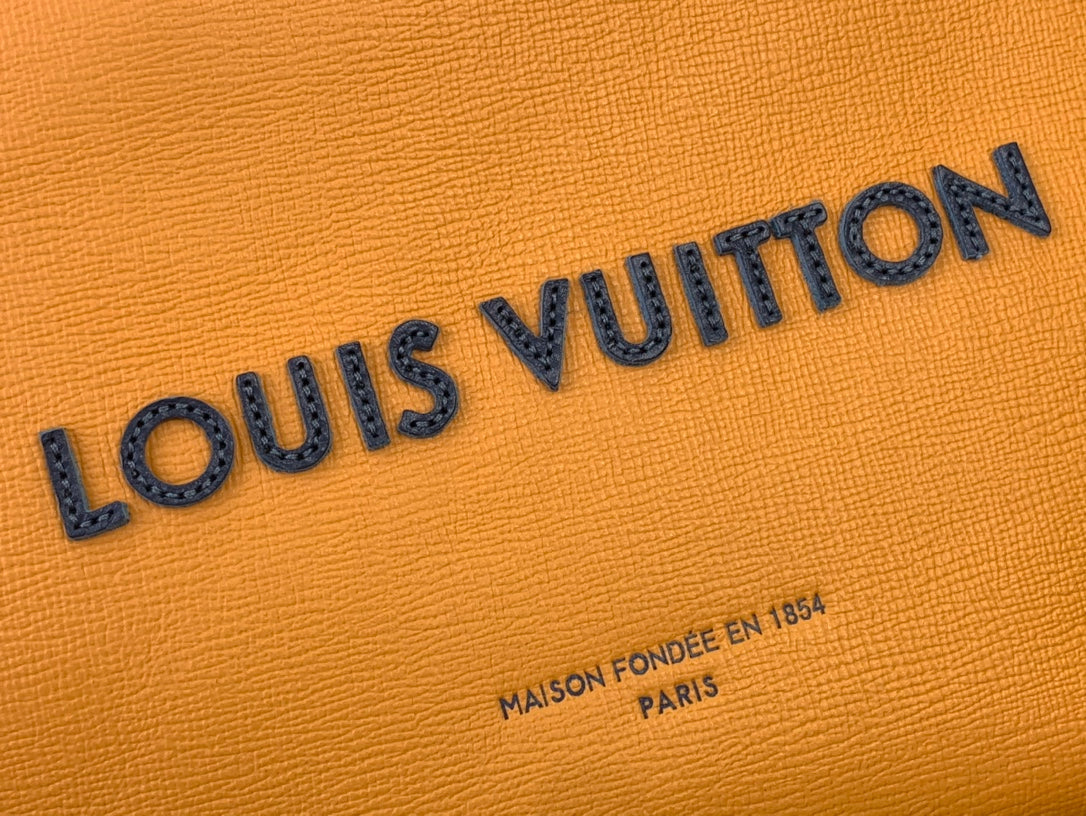 Orange textured leather with embossed Louis Vuitton lettering and small print.