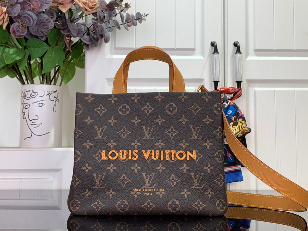 Louis Vuitton tote bag in brown monogram canvas with tan leather handles and strap.