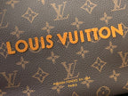 Brown monogram canvas with gold Louis Vuitton lettering and small text.