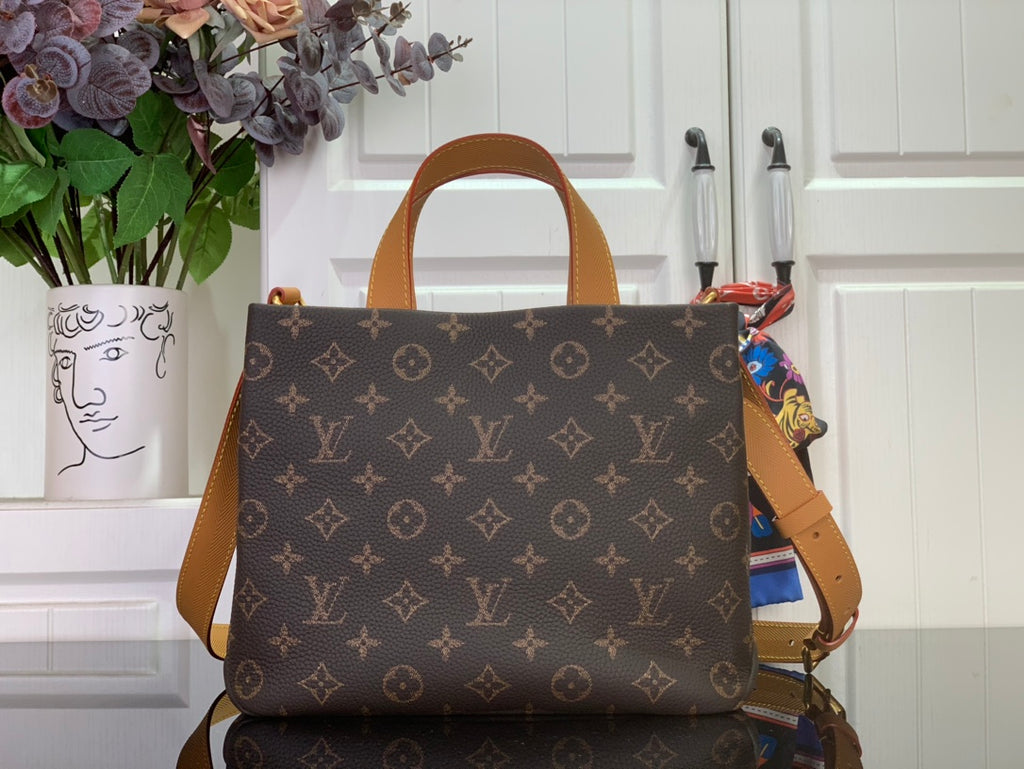 Tote bag with brown monogram canvas and tan leather top handles, front view.