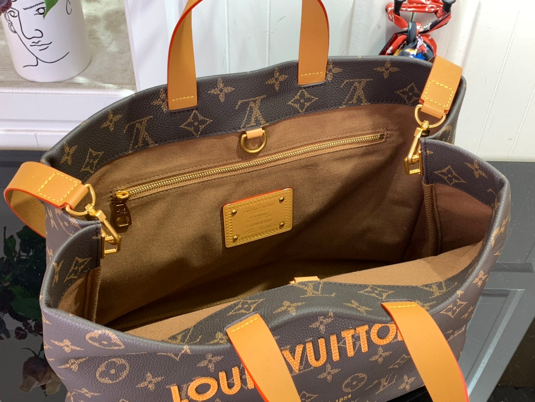 Louis Vuitton monogram tote bag open interior with tan lining and zipper pocket