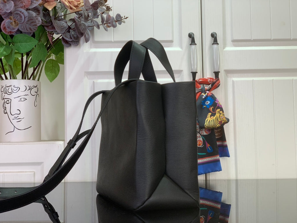 Louis Vuitton leather tote bag side view with long shoulder strap, black