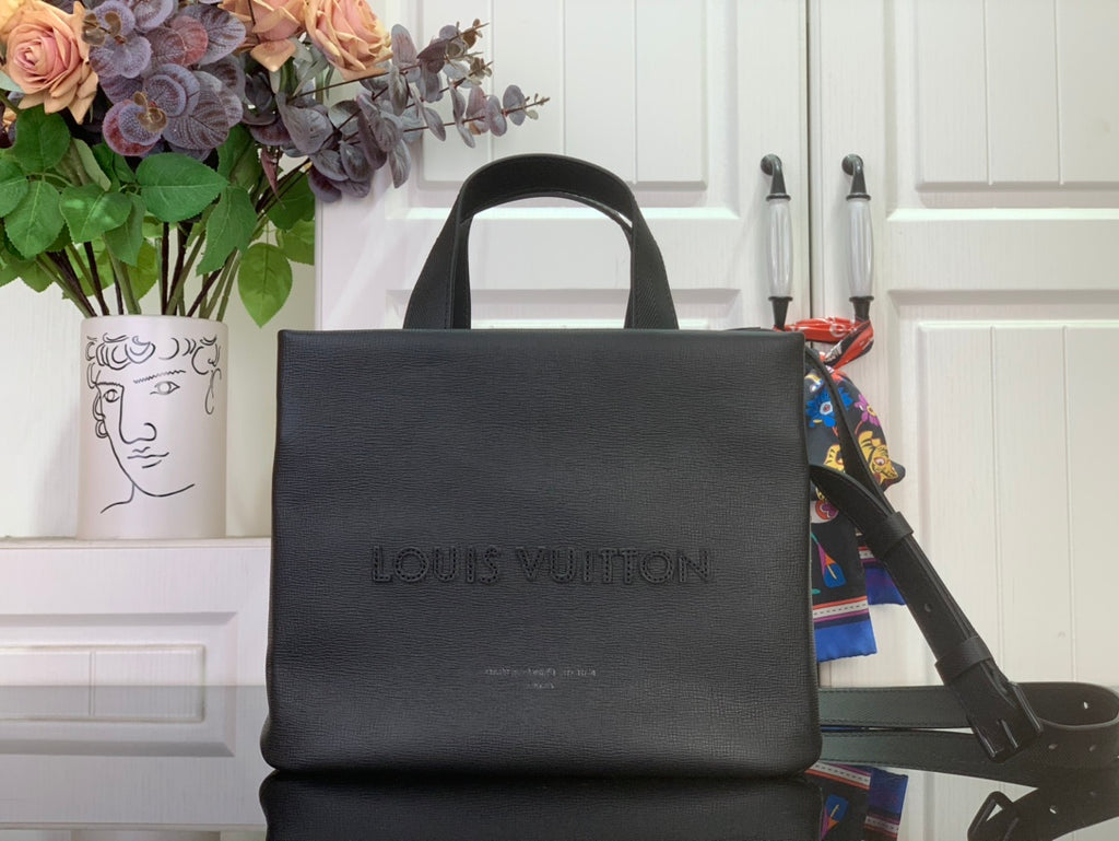 Louis Vuitton tote bag with top handles and embossed logo on dark leather