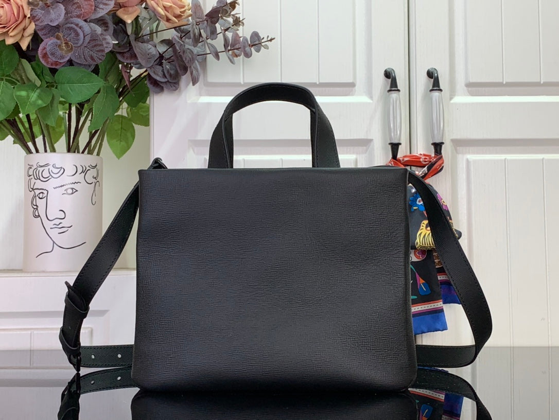 Louis Vuitton leather tote bag front view with shoulder strap, black