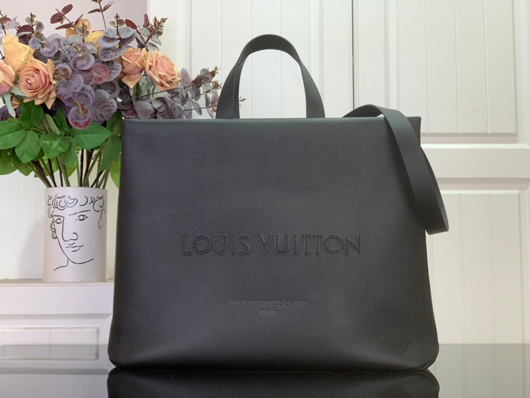 Tote bag with dark gray smooth leather, top handles, and front Louis Vuitton logo