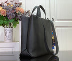Tote bag with curved handles and wide front opening, dark gray leather exterior