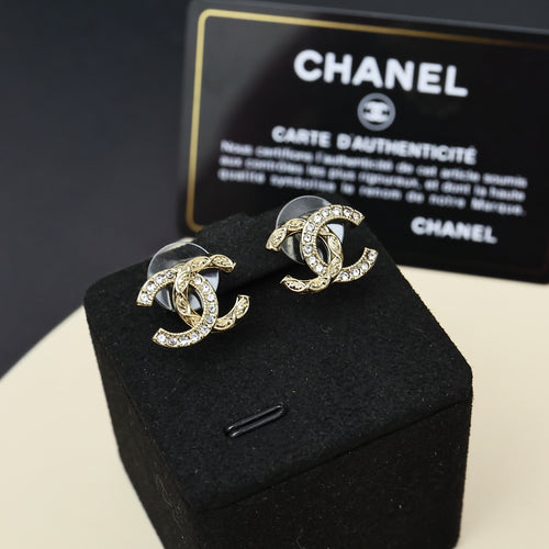 Gold-tone Chanel-style CC stud earrings with rhinestone detailing