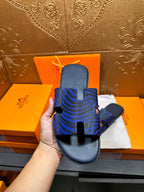Blue patterned slide sandals showing footbed and toe strap
