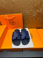 Blue patterned slide sandals with black adjustable strap