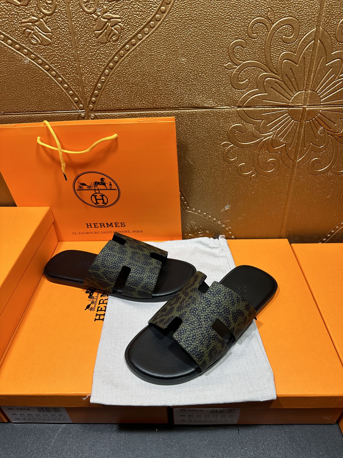 Hermes luxury slide sandals, dark patterned straps and open back