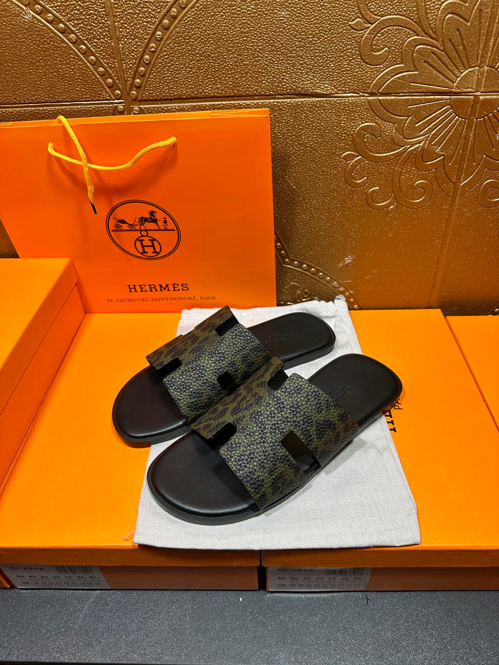 Hermes luxury slide sandals, single wide strap with dark patterned print