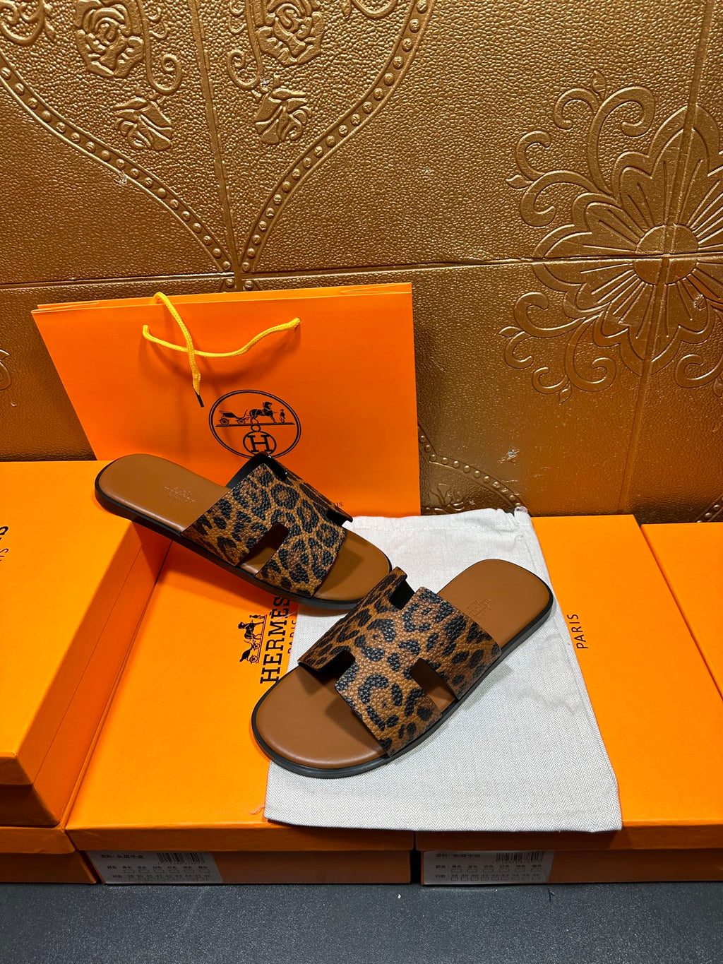 Hermes leopard-print slide sandals with tan footbed and wide straps