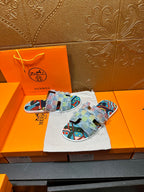Patchwork Hermes slide sandals, laid on cloth with multicolor strap panels and graphic print