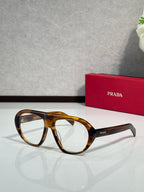 Prada oversized cat-eye sunglasses with tortoiseshell frames and dark lenses