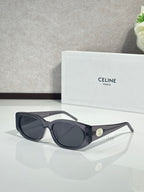Celine oval sunglasses, dark glossy frame with dark lenses and gold logo detail