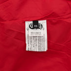 Red varsity jacket with white size label on interior fabric
