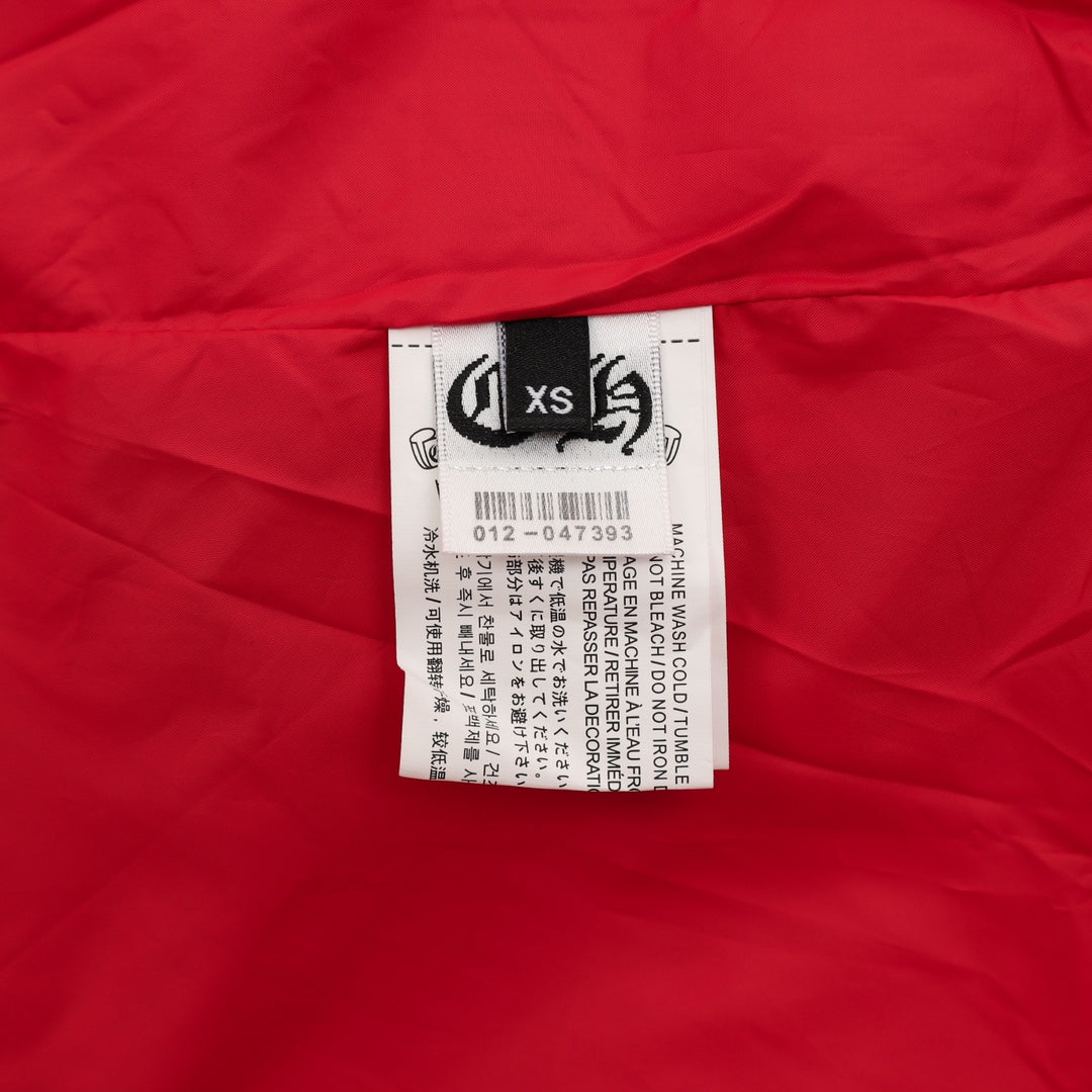 Red varsity jacket with white size label on interior fabric
