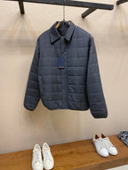Dark blue long puffer jacket with full front zipper and stand collar