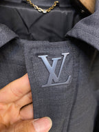 Louis Vuitton logo patch on dark blue jacket fabric