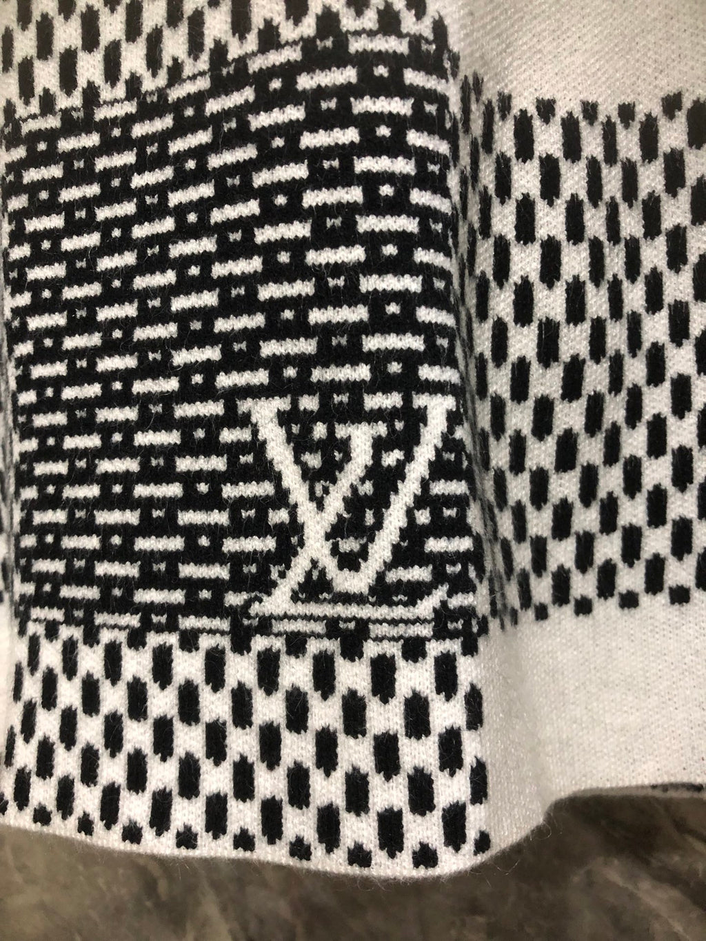 Long-sleeve sweater with black-and-white patterned knit and LV-style emblem