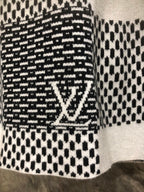 Long-sleeve sweater with black-and-white patterned knit and LV-style emblem