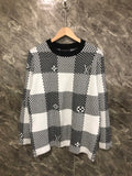 Long-sleeve sweater in black-and-white check knit with Louis Vuitton motifs