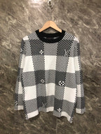 Long-sleeve sweater in black-and-white check knit with Louis Vuitton motifs