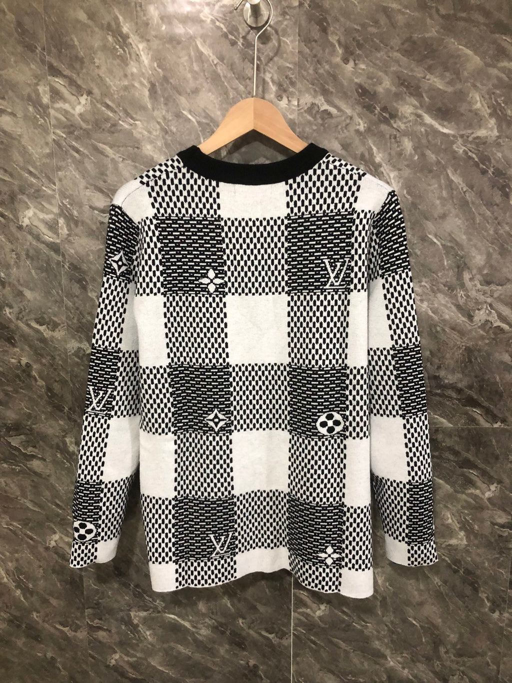 Long-sleeve sweater front in black-and-white check knit with Louis Vuitton emblems