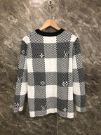 Long-sleeve sweater front in black-and-white check knit with Louis Vuitton emblems