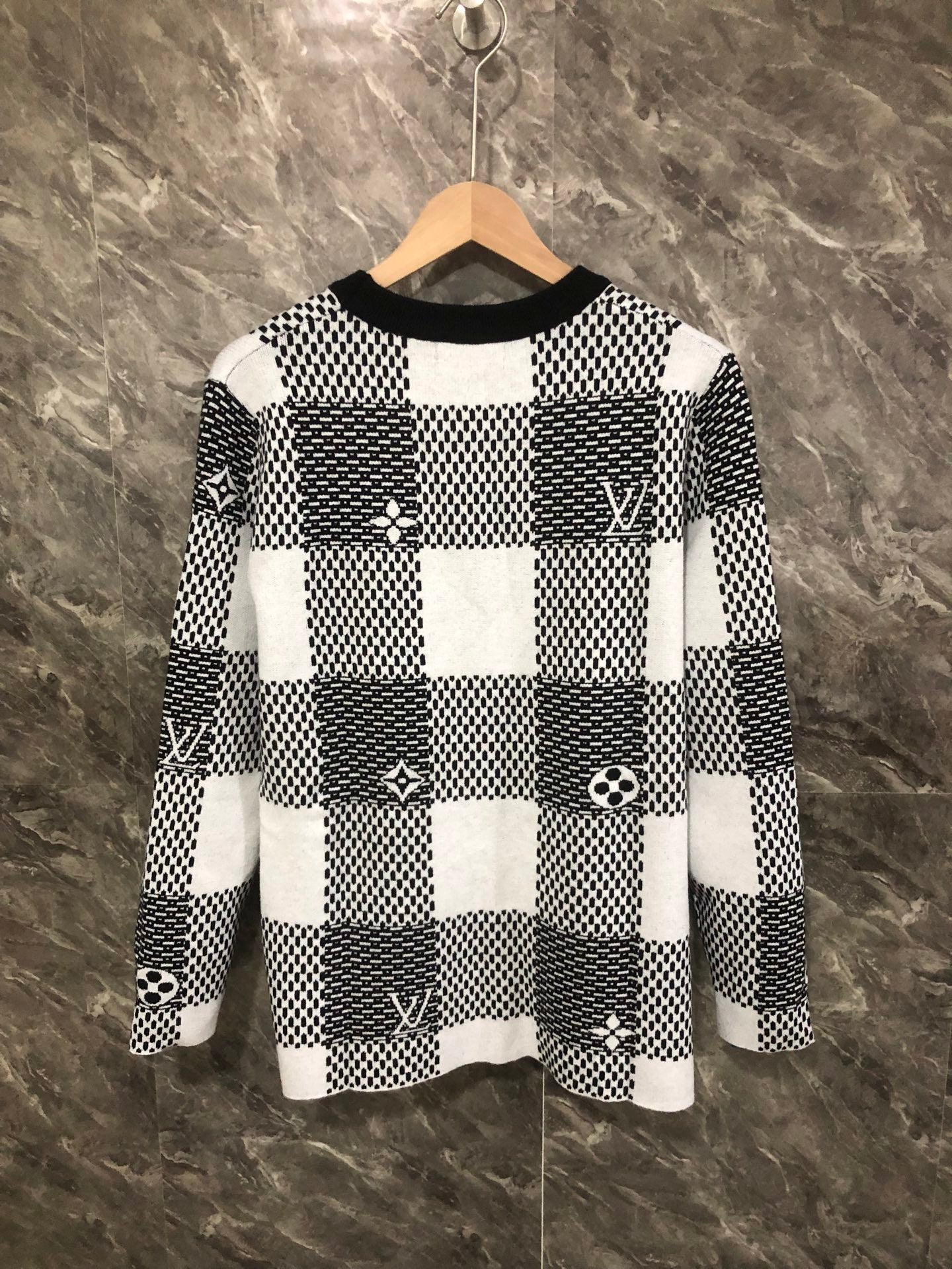 Long-sleeve sweater front in black-and-white check knit with Louis Vuitton emblems