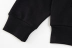 Black long-sleeve hoodie cuffs and ribbed hem