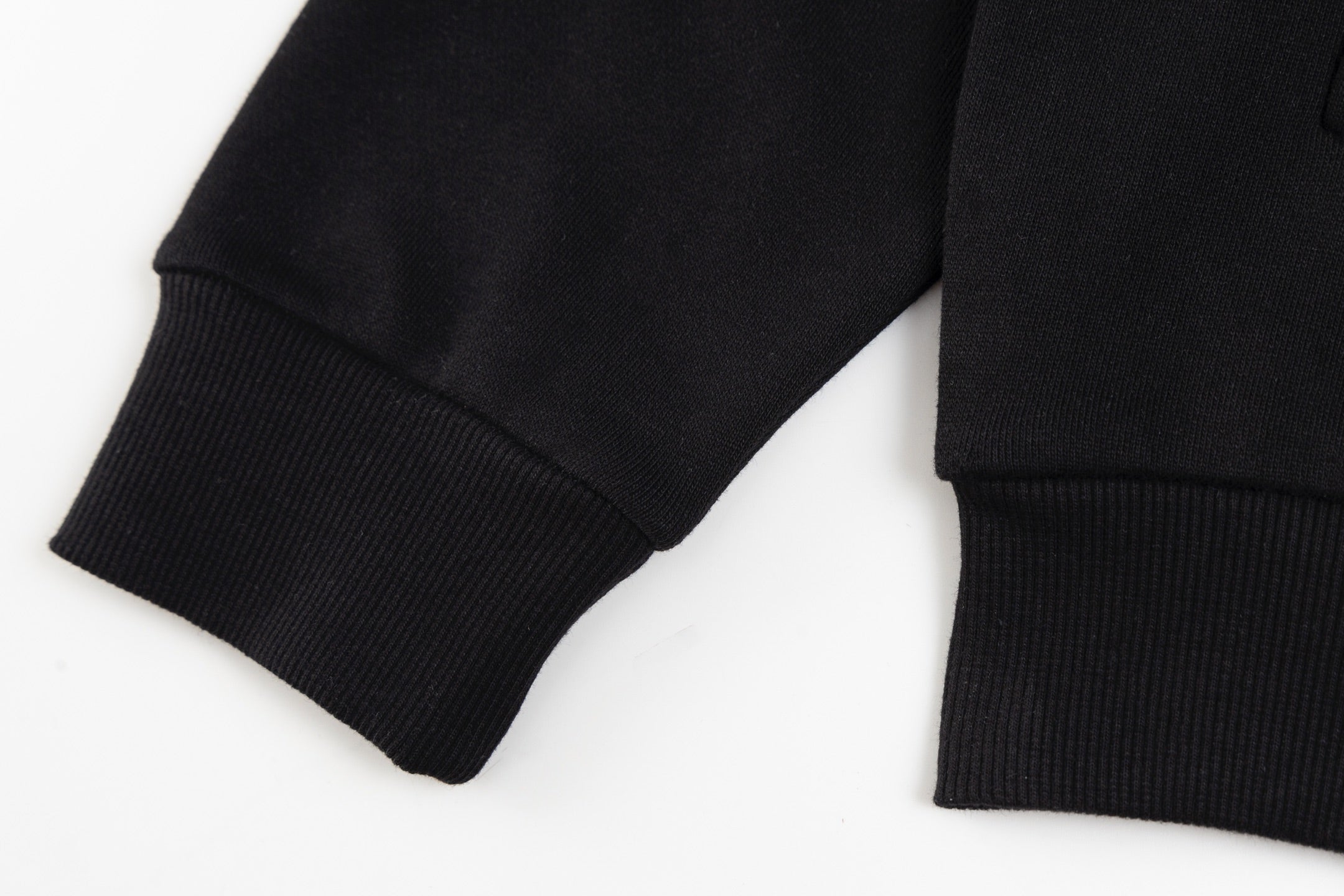 Black long-sleeve hoodie cuffs and ribbed hem