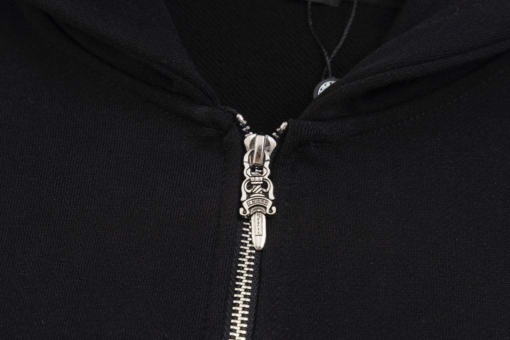 Black hoodie zipper with metal pull tab and hooded neckline hardware