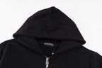 Black hoodie hood and zipper top, with small brand label inside neckline
