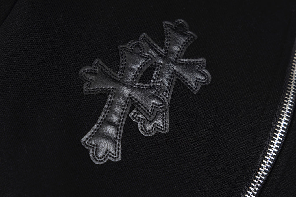 Black hoodie sleeve cross embroidery with textured stitched edges