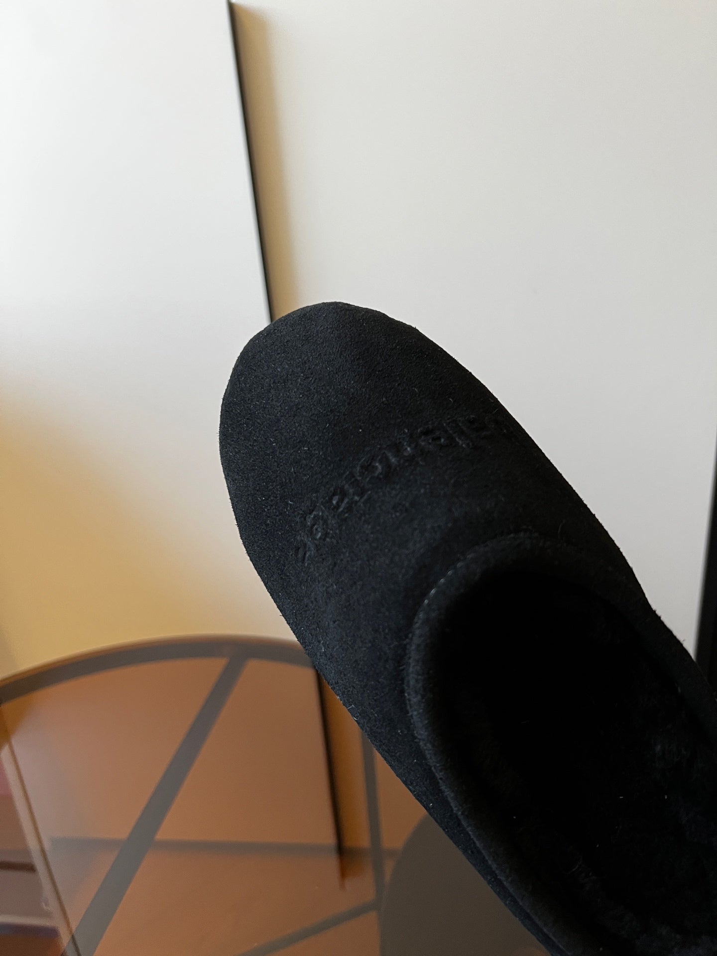 Balenciaga dark suede mule close-up of side and plush lining interior