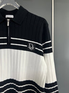 Long-sleeve knit polo sweater close-up: zip placket, ribbed collar, striped design