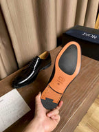 Dior unisex lace-up oxford shoes, black leather; orange insole sole with CD logo