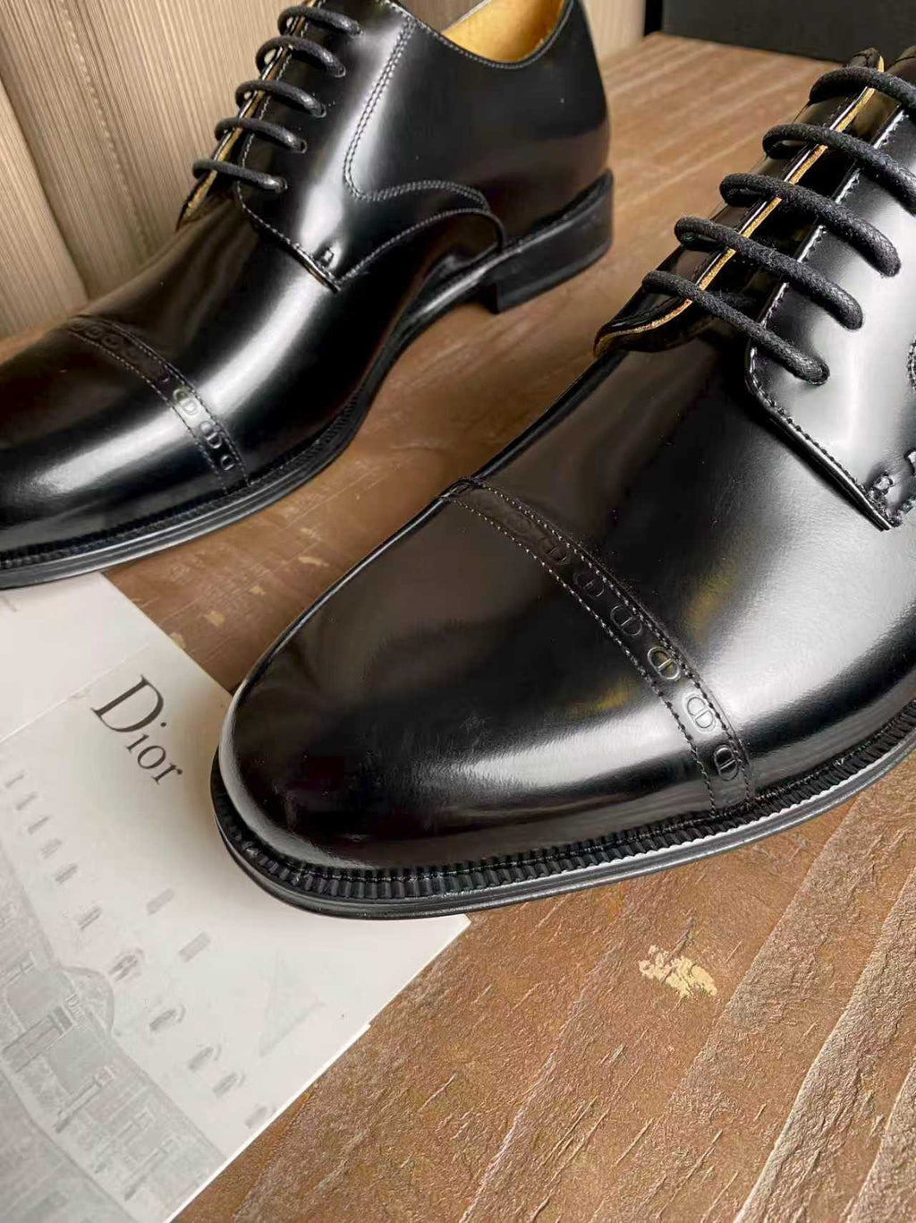 Dior unisex lace-up oxford dress shoes close-up, black leather and stitched sole